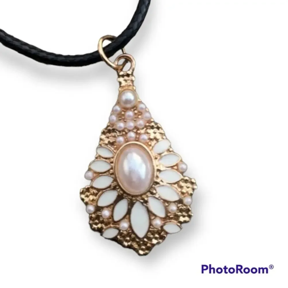Gold tone and faux pearl ornate pendant necklace, waxed black cotton cord